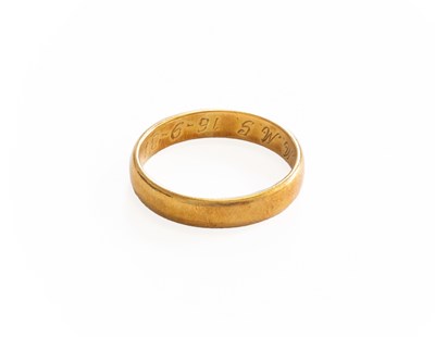 Lot 306 - An 18 Carat Gold Band Ring, finger size V