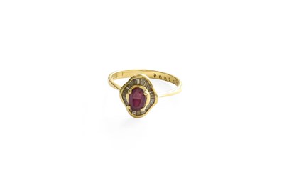 Lot 299 - A Red Stone and Diamond Cluster Ring, an oval...