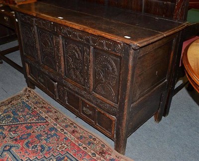 Lot 471 - An 18th century carved oak mule chest