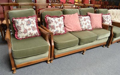 Lot 498 - A mid-20th century three piece bergere suite with loose cushions