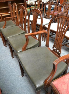 Lot 500 - A set of four arch-backed dining chairs