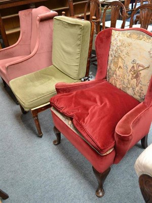 Lot 502 - An Edwardian pink velvet upholstered wing armchair, another later armchair and a beech framed...