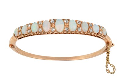 Lot 2389 - An Opal and Diamond Bangle nine graduated oval...