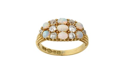 Lot 2388 - An Opal and Diamond Ring the oval cluster set...