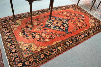 Lot 511 - Lilihan Rug, West Persia, the faded tomata field of flowering plants centred by an indigo medallion