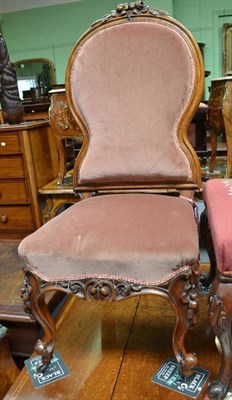 Lot 515 - A Victorian walnut framed nursing chair