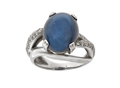 Lot 2286 - A Star Sapphire and Diamond Ring the oval...