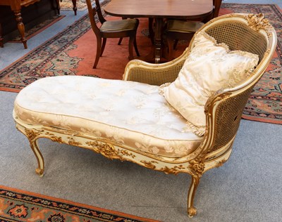 Lot 1272 - A French Parcel Gilt and Cream Painted Chaise...