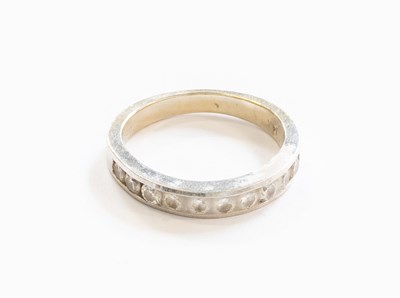 Lot 391 - A Diamond Half Hoop Ring, ten round brilliant...