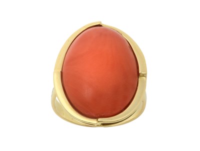 Lot 2222 - A Coral Ring the oval cabochon coral within an...