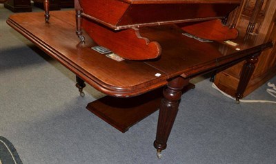 Lot 549 - A Victorian mahogany wind out dining table with two leaves