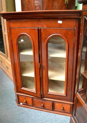 Lot 550 - A late Victorian mahogany glazed hanging corner cabinet