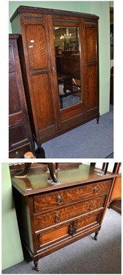 Lot 555 - An early 20th century oak three piece bedroom suite comprising wardrobe, bed ends and chest of...