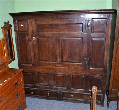 Lot 556 - An 19th century oak hall cupboard inscribe AD1725