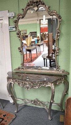 Lot 560 - A French style console table in silver with marble top and similar over mantel wall mirror