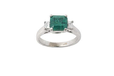 Lot 2311 - An Emerald and Diamond Three Stone Ring the...