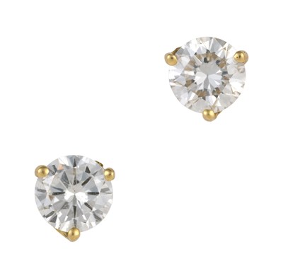 Lot 2342 - A Pair of Diamond Solitaire Earrings the round...