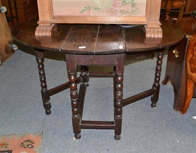 Lot 567 - An 18th century oak gateleg table with bobbin turned legs