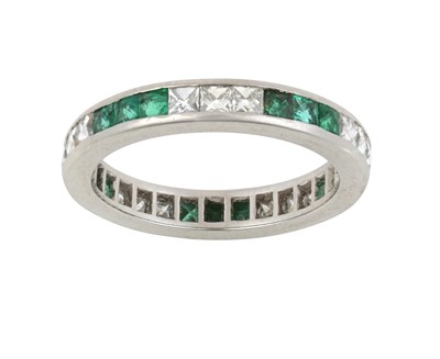 Lot 2093 - An Emerald and Diamond Eternity Ring trios of...