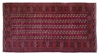 Lot 438 - Afghan Tekke Carpet Circa 1950 The raspberry...