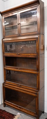 Lot 1386 - A Pair of Oak Five Tier Globe Wernicke Style...