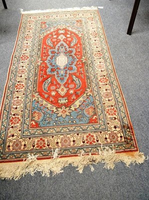 Lot 584 - Bandamar rug, West Anatolia, the rust field centred by an ice blue medallion enclosed by ivory...