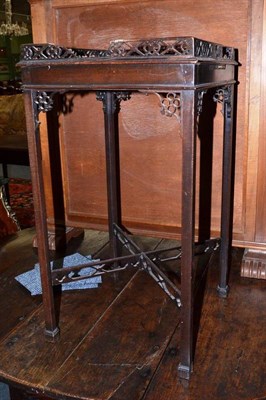 Lot 585 - Square mahogany urn table with fretted gallery