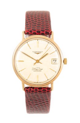 Lot 2502 - Longines: A 9 Carat Gold Automatic Calendar...