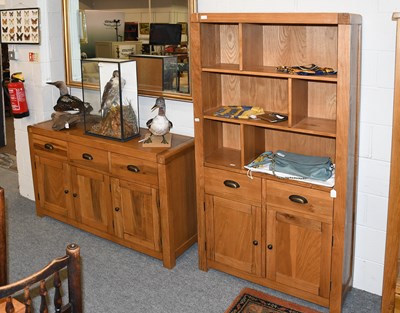 Lot 1245 - A Modern Oak Three Drawer Sideboard, 134cm by...