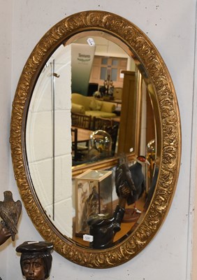 Lot 1247 - A Gilt Framed Oval Mirror, with bevelled plate,...