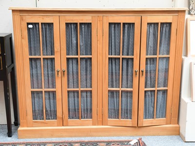 Lot 1290 - A Modern Oak Low Cabinet, with four glazed...