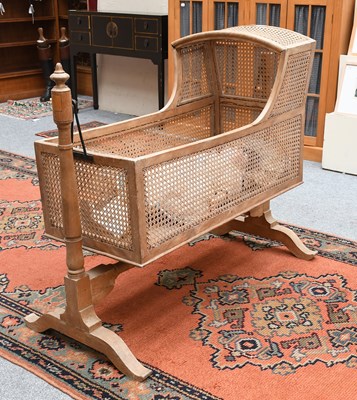 Lot 1289 - A Victorian Caned Cradle, on trestle base,...