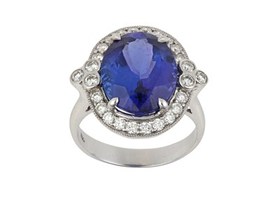 Lot 2139 - A Tanzanite and Diamond Cluster Ring the oval...