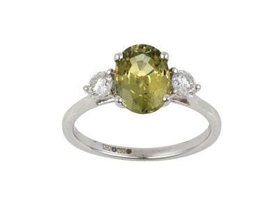 Lot 2115 - An 18 Carat White Gold Green Sapphire and...