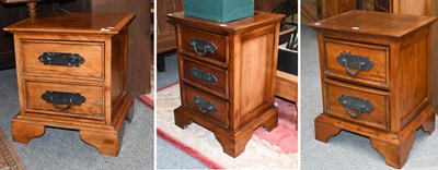 Lot 1275 - A Pair of Continental Hardwood Two Drawer...
