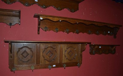 Lot 603 - Five assorted carved oak wall mounted coat racks