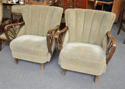 Lot 611 - A pair of circa 1930s armchairs with scalloped backs