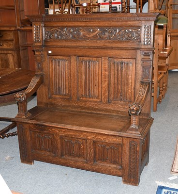 Lot 1370 - An 18th Century Style Carved Oak Box Settle,...