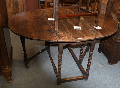 Lot 1368 - An 18th Century Oak Gate Leg Table, on turned...