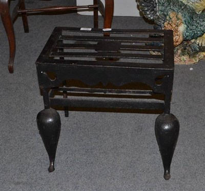 Lot 708 - A black painted cast footman