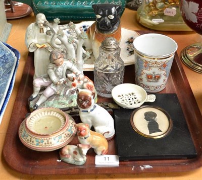 Lot 11 - Creamware egg strainer, two Staffordshire figures, three pugs, a glass caster, a plate jug, a...