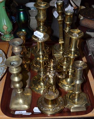 Lot 37 - Tray of assorted brass candlesticks etc