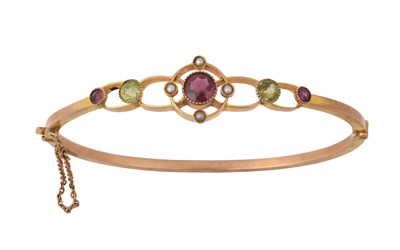 Lot 2379 - A Garnet, Peridot and Split Pearl Hinged...