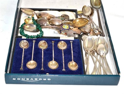 Lot 73 - A collection of assorted silver and plated spoons and a malachite bracelet