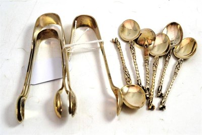 Lot 77 - Three various sugar nips and set of six silver apostle spoons