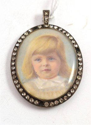 Lot 94 - A framed portrait miniature locket of a young girl in a paste set frame