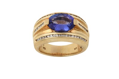Lot 2297 - A Tanzanite and Diamond ring the broad yellow...