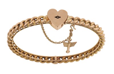 Lot 2052 - A 'Key to my Heart' Bangle, circa 1930 the...