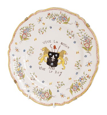 Lot 138 - A French Faience Plate, 1793, painted in...