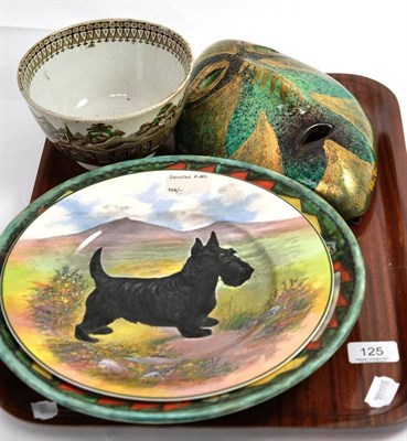 Lot 125 - Royal Doulton plate of a Scotty dog, a Crown Devon tube line decorated charger, a pottery slop bowl